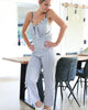 Zachtblauwe jumpsuit met knoop